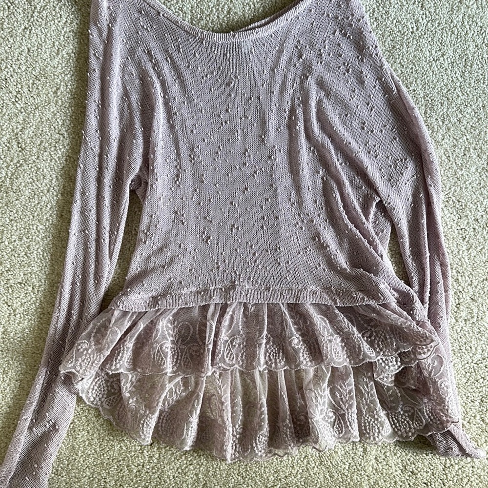 Cute purple sweater with ruffle detail on bottom